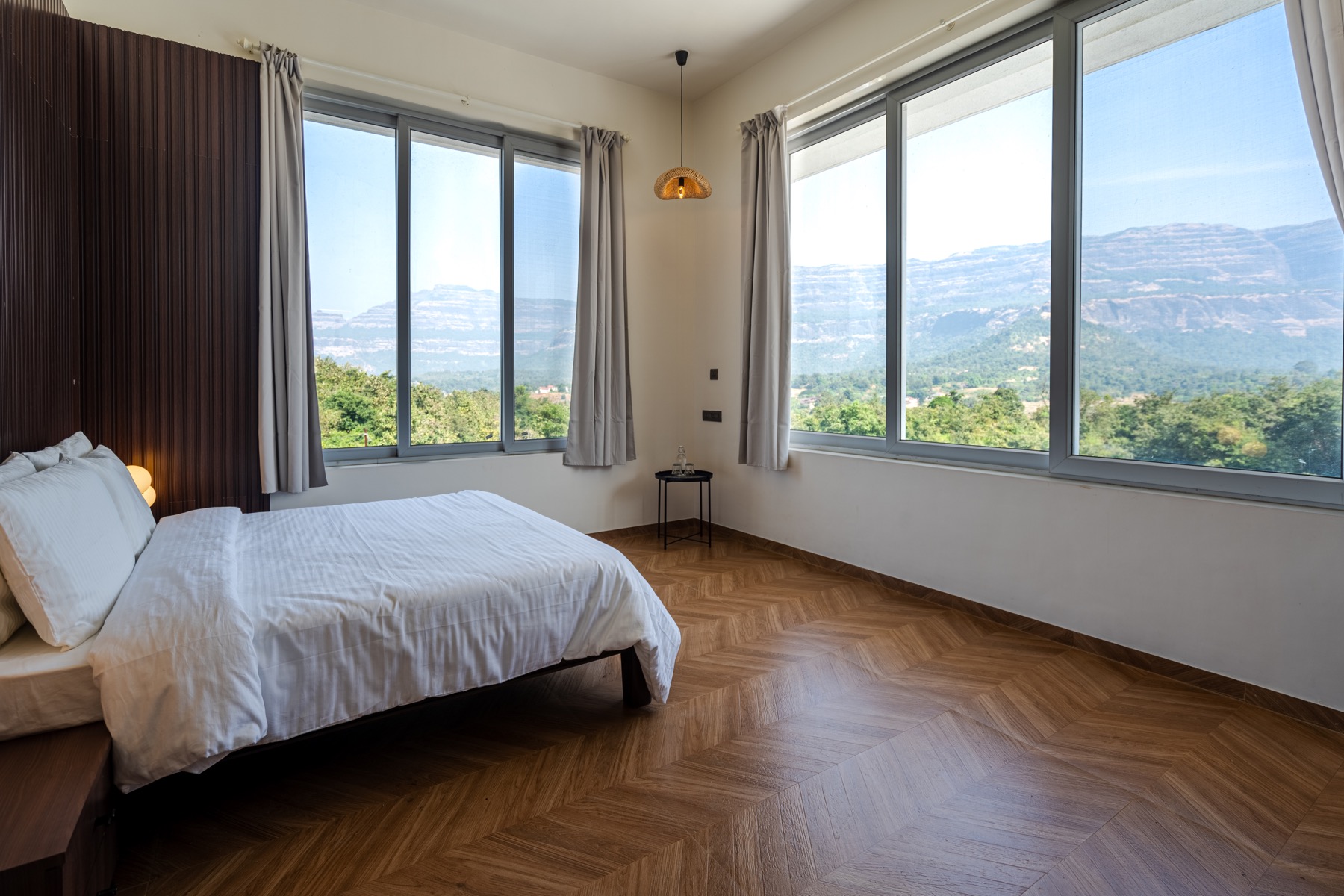 Private bedroom with Sahyadri mountain view at 7 Farms Karjat